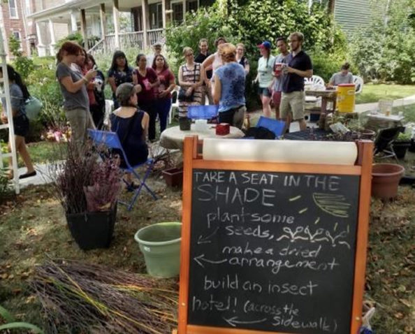 Visitors learn about the pollinators habitat at a Community Celebration.