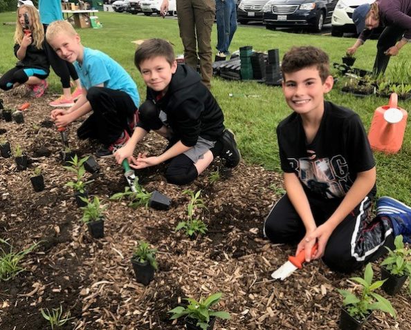 4th graders came out with their classrooms to help plant the pollinator habitat.