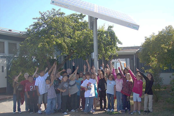 Students with a solar panel
